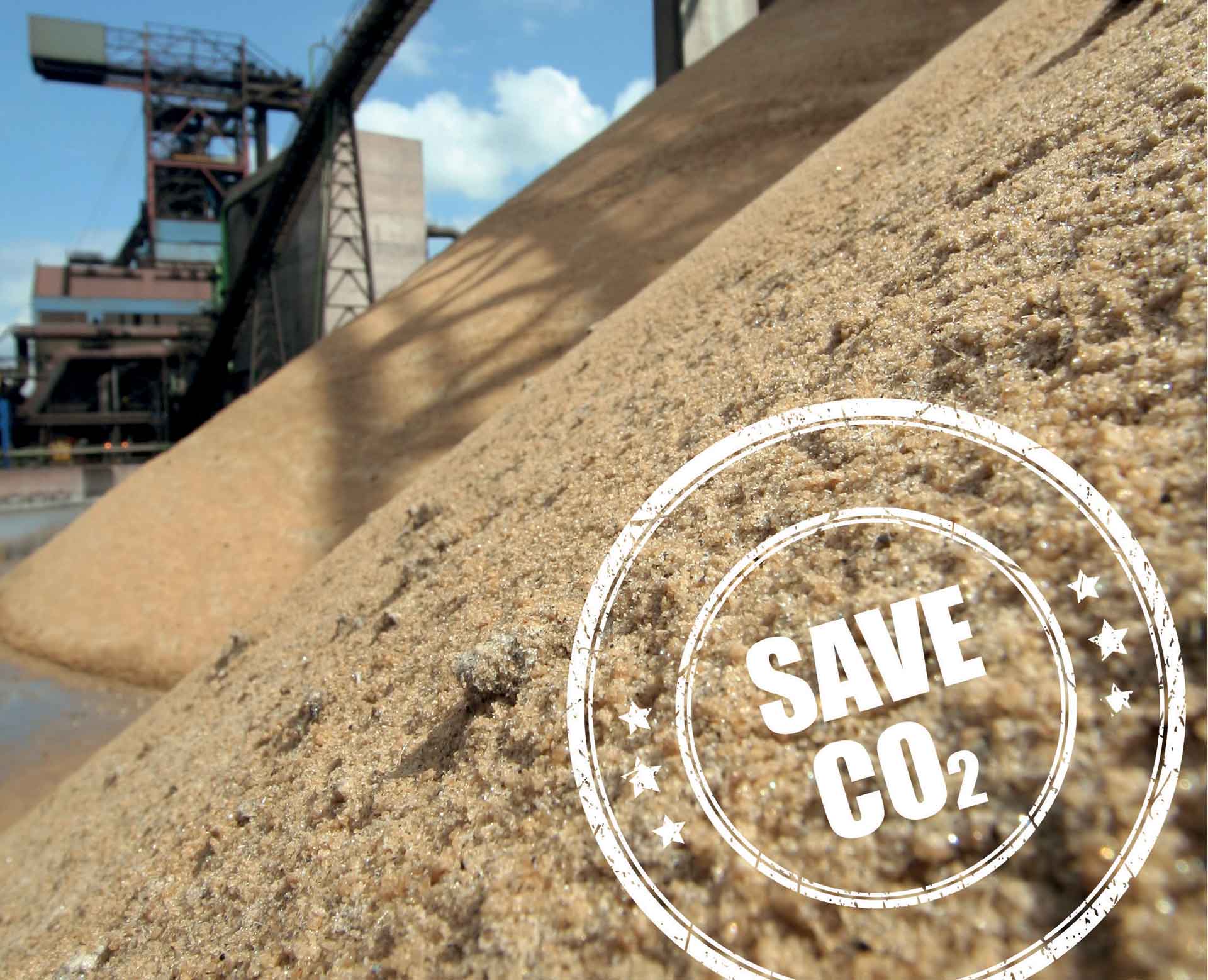 Picture of a sand mountain with a stamp on it that says SAVE CO₂