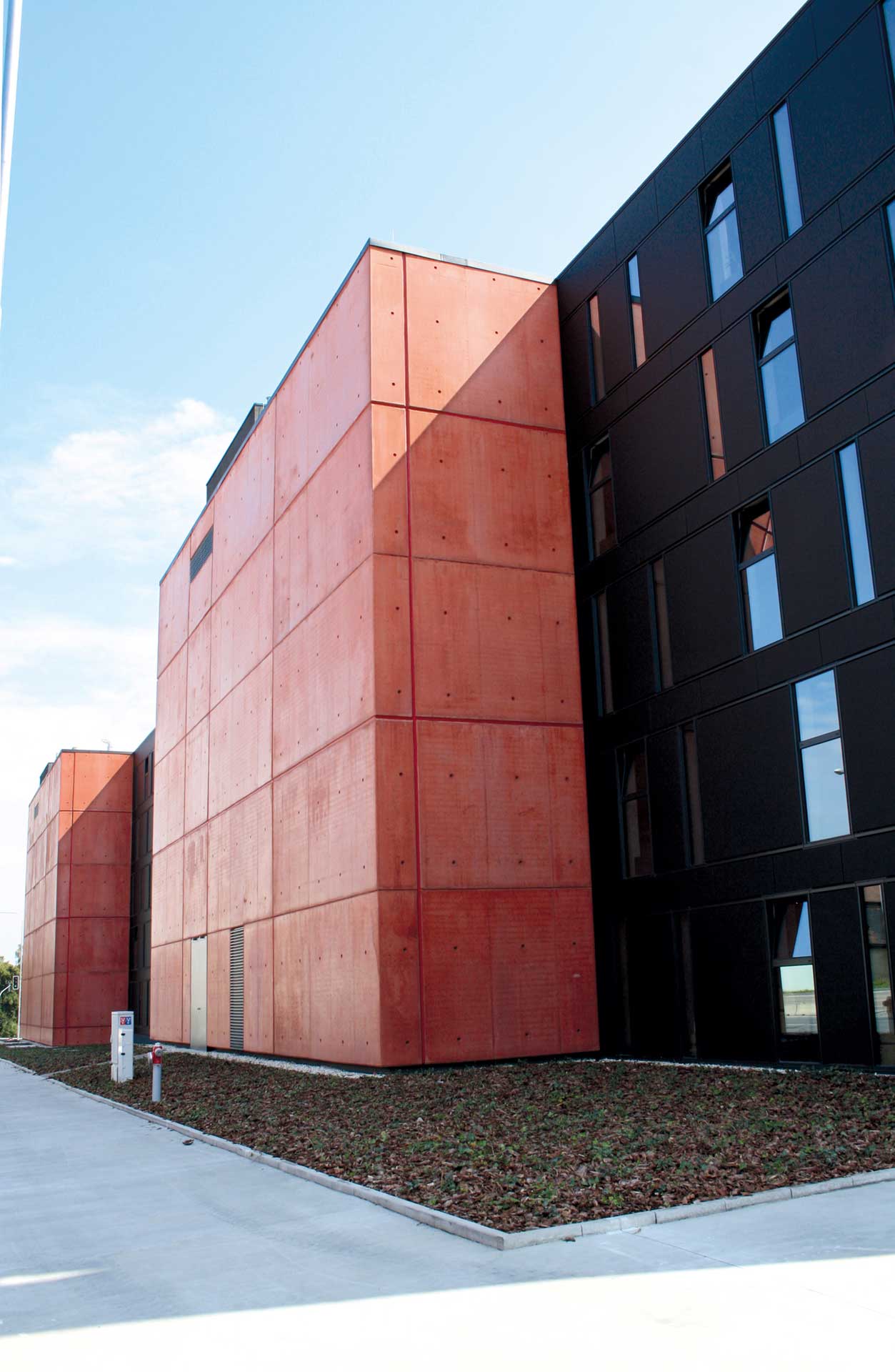 Building with alternating black and bright red facade