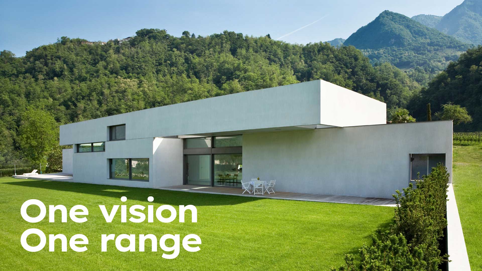 Modern concrete building surrounded by greenery, text: One vision, one range