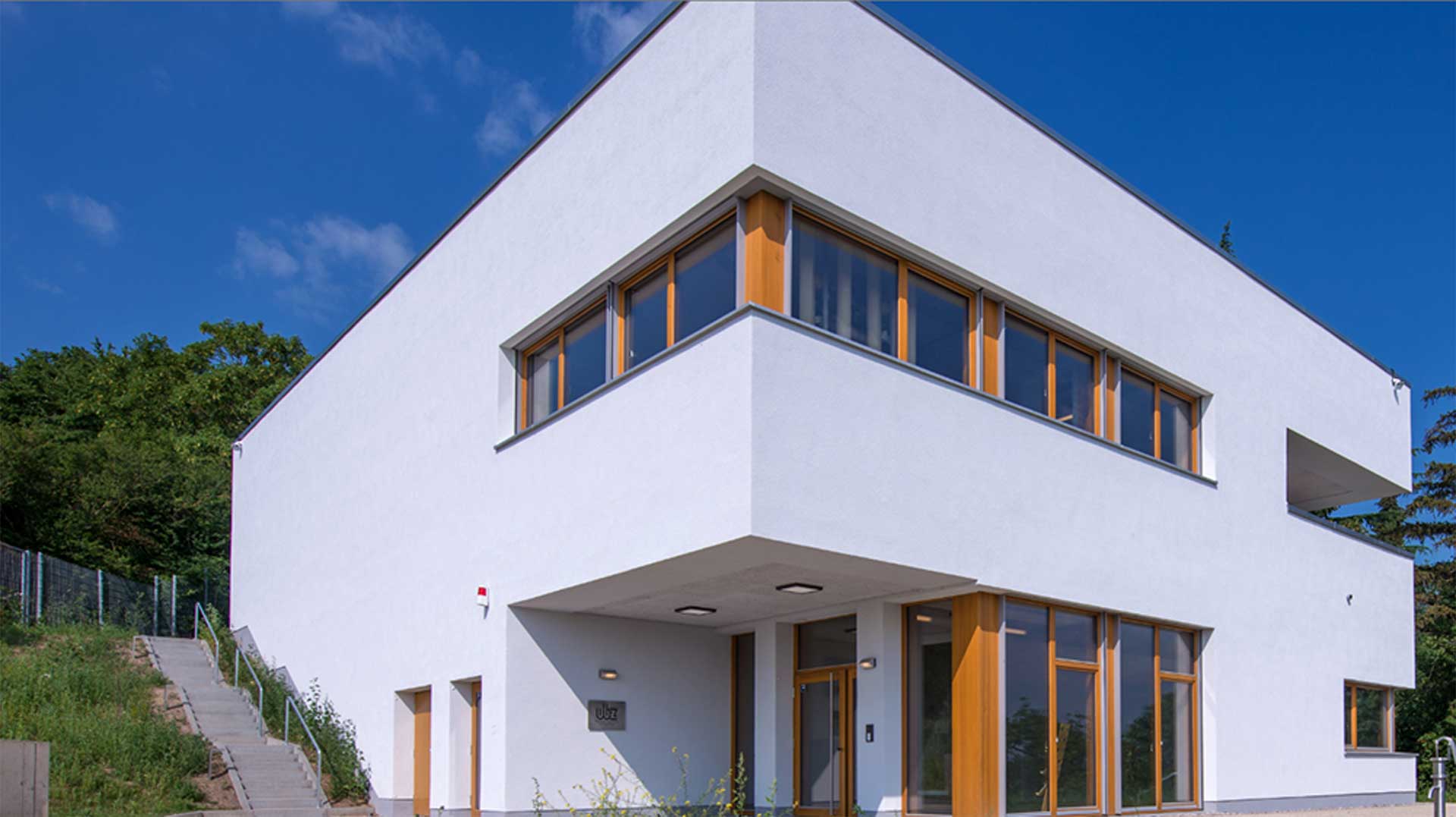 Modern white building against a blue sky